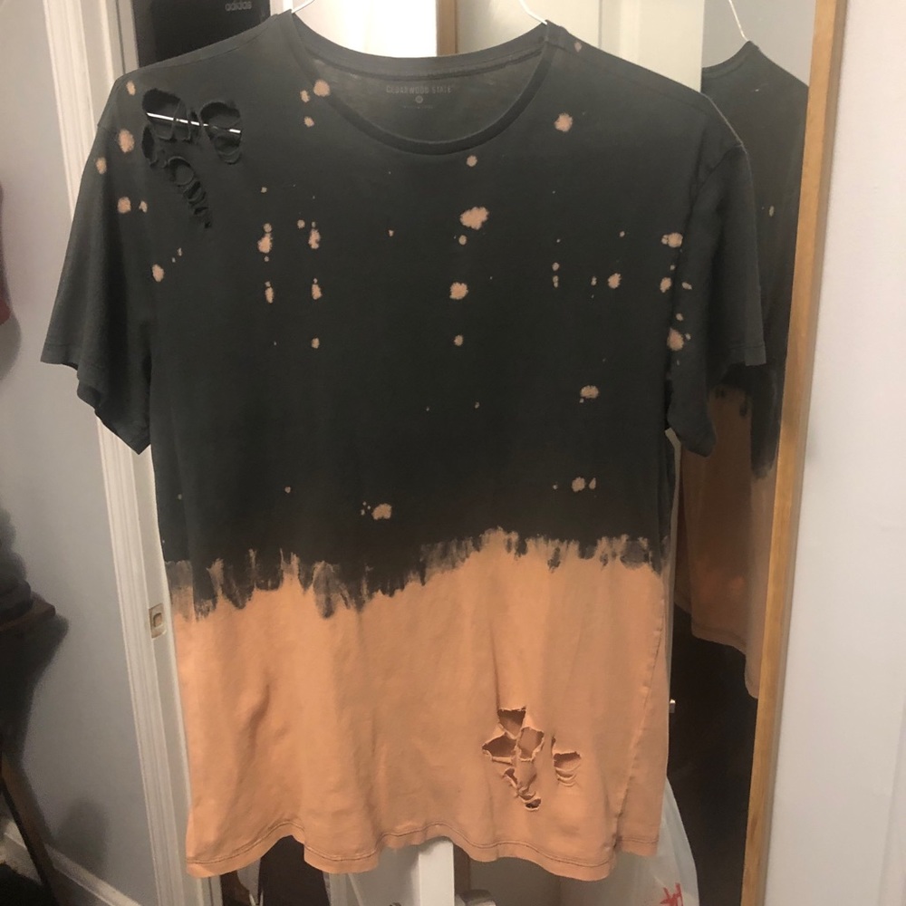 Torn/destroyed black and orange tee